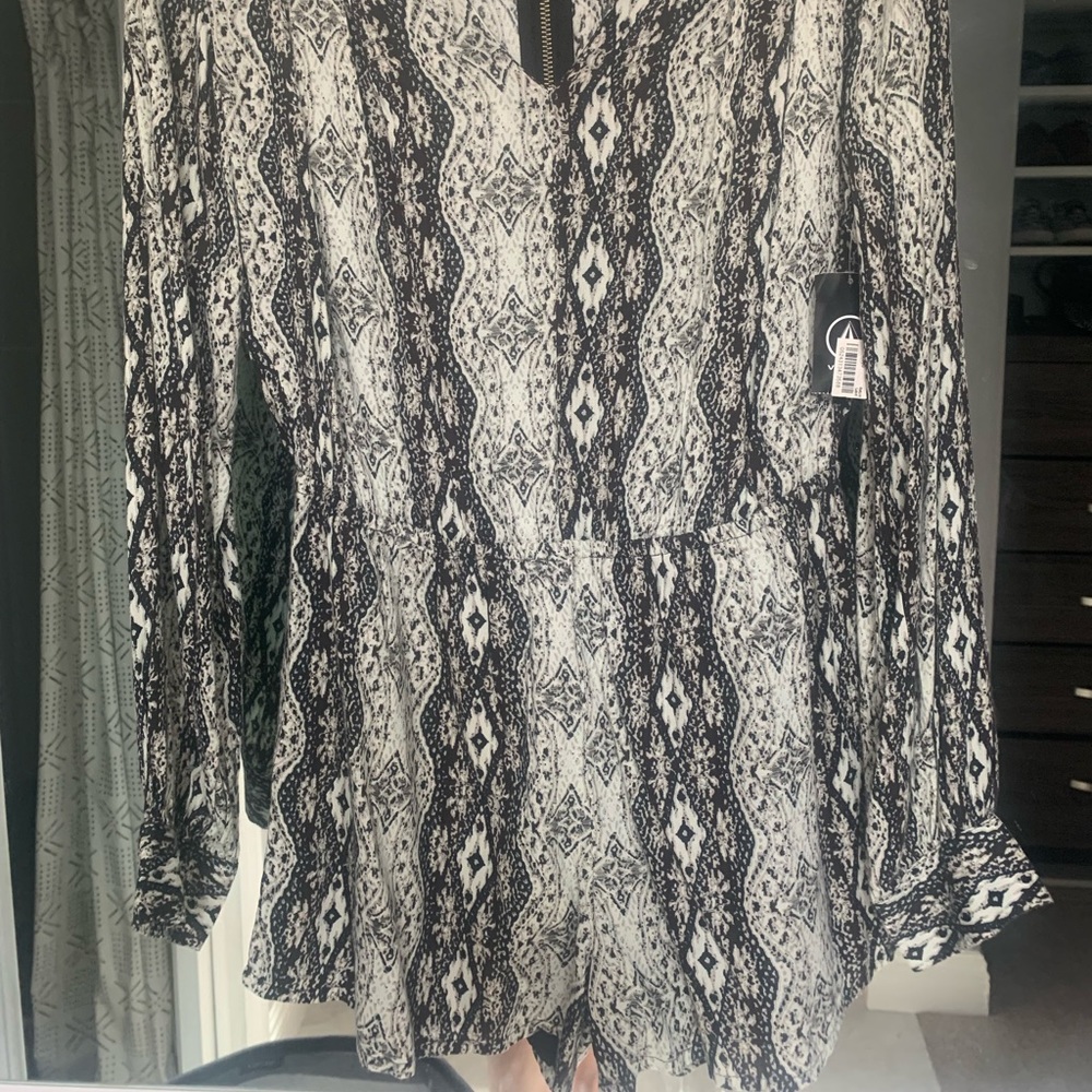 Volcom long sleeve romper, super cute, never worn.